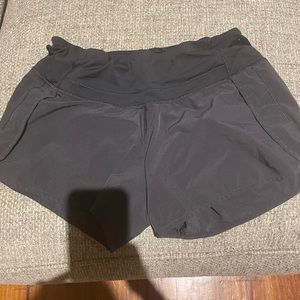 Lululemon size 6  Black speed up running shorts.